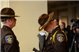 Officer inspects honor guard rifle