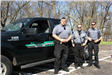 Anoka County Park Rangers stand in front of truck