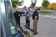 Commissioner Gamache is shown the bus' bike rack attachment