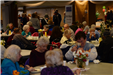 Visitors eat a meal served at the Senior Expo