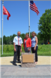 Commissioners Kordiak, Braastad, and Sivarajah with the new plaque