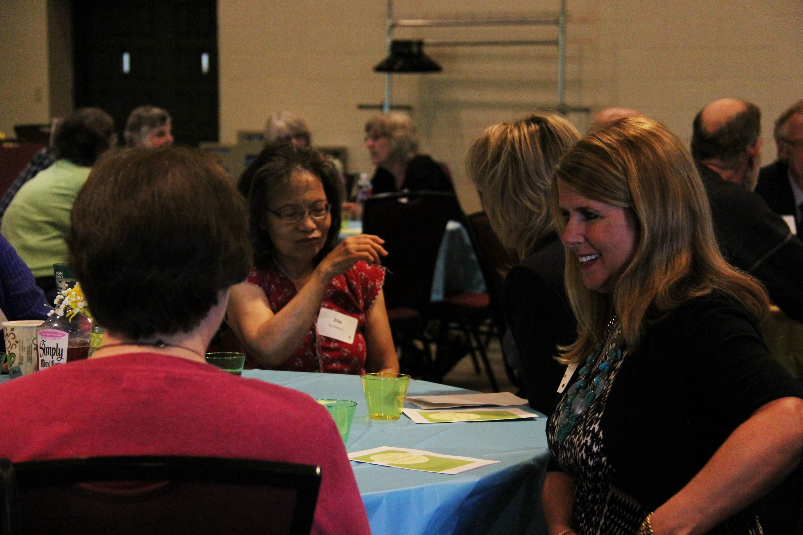 Commissioner Julie Braastad visits with RSVP event guests