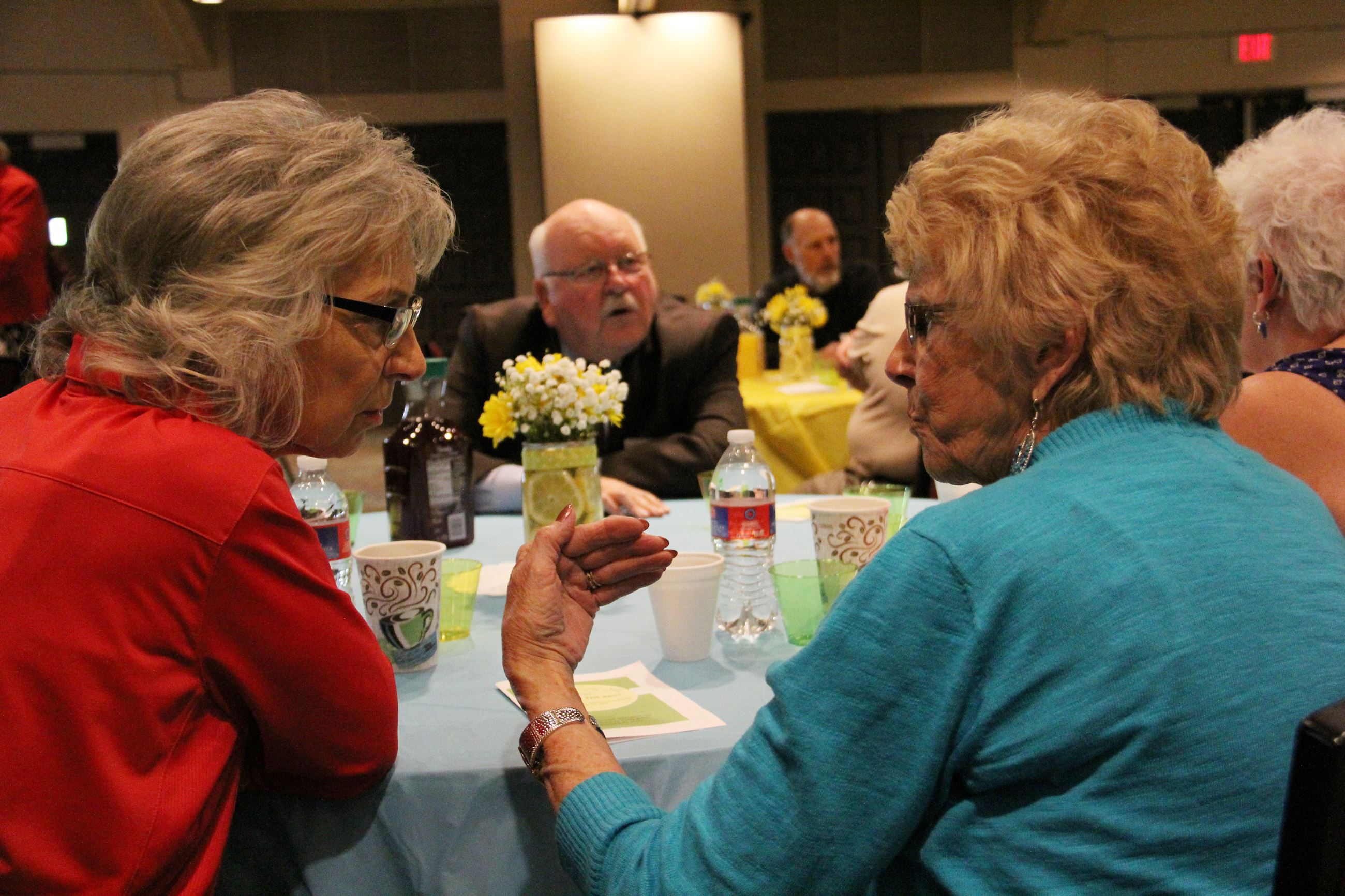 RSVP event guests sitting at a table