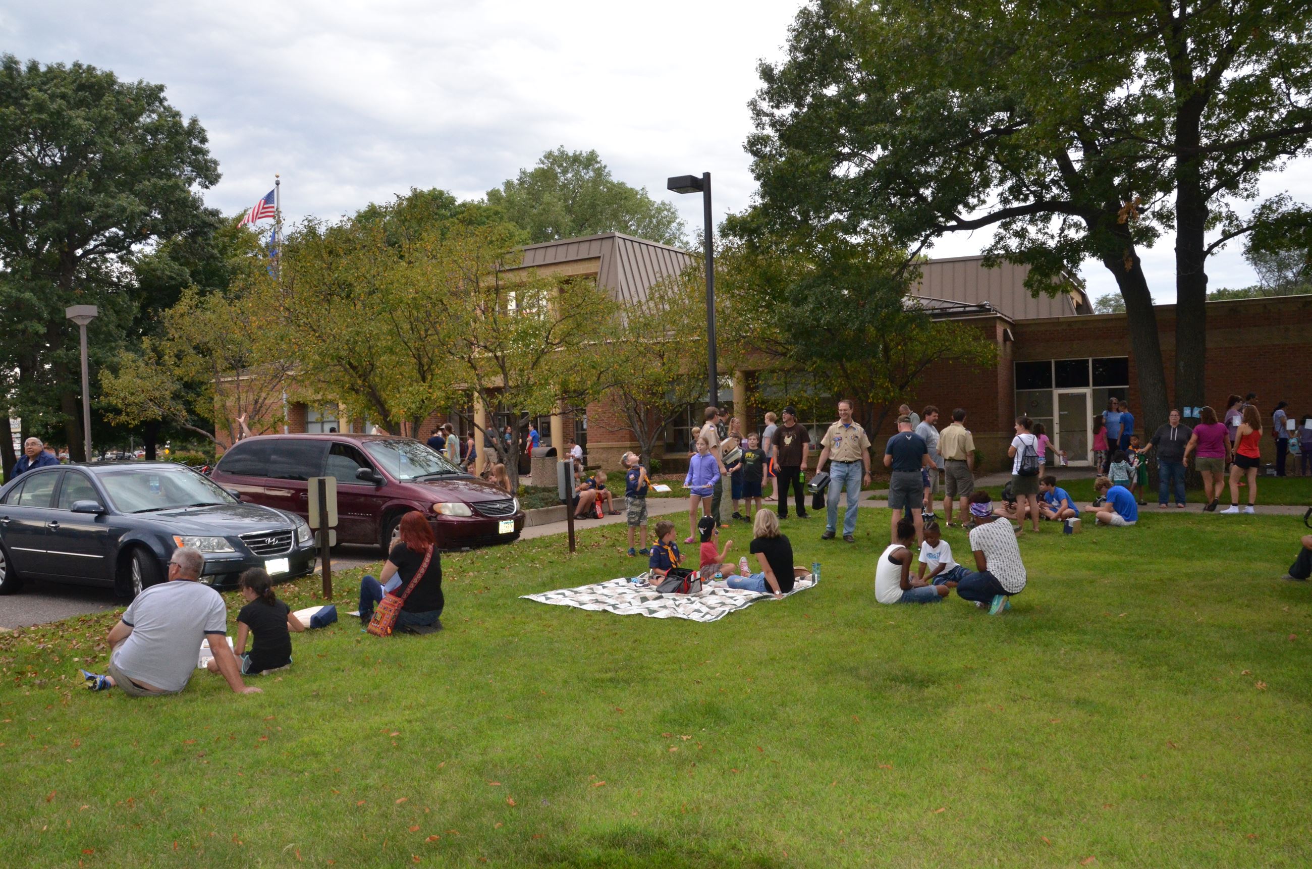 Event goers spread out on the lawn