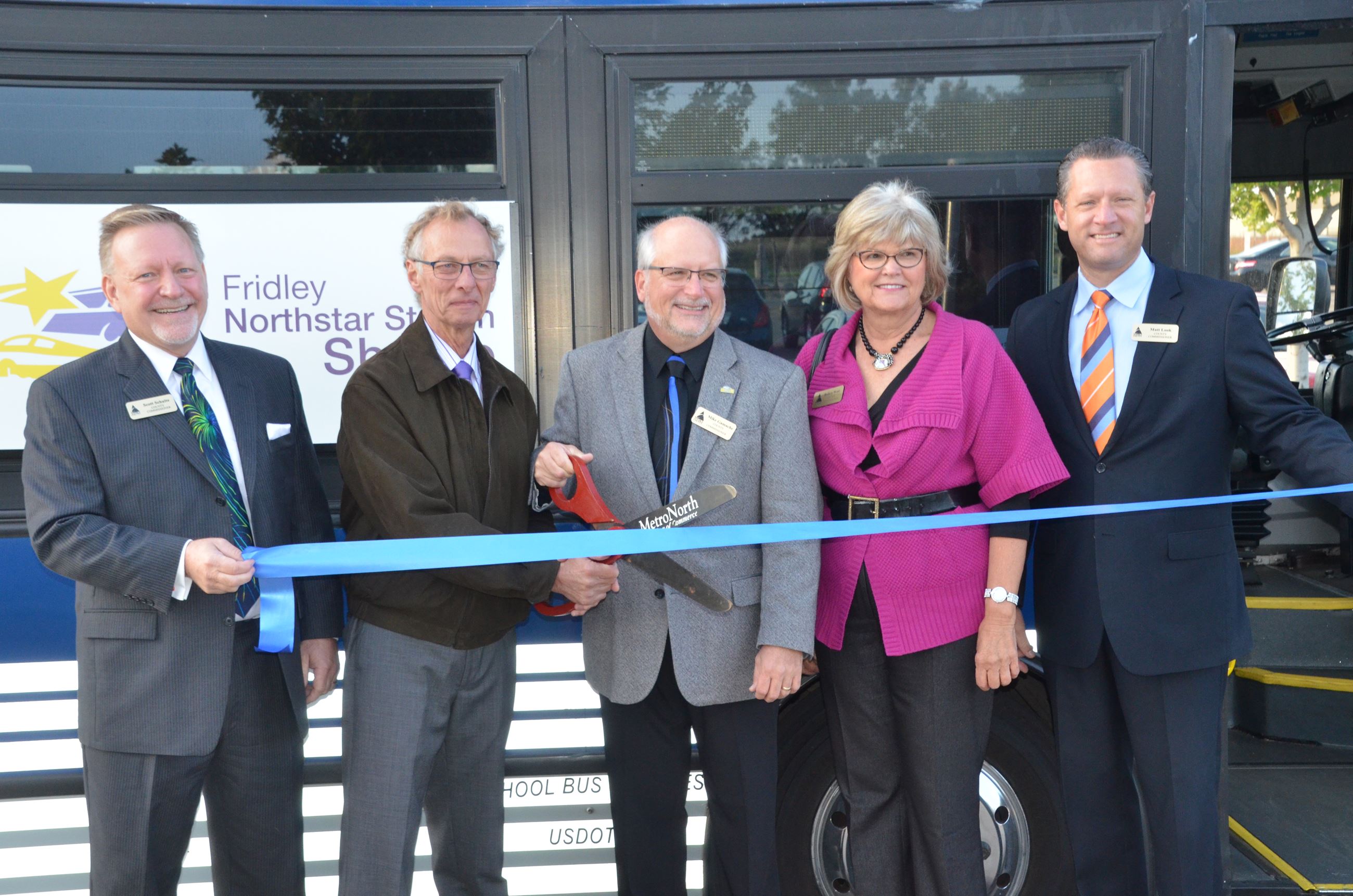 Commissioners Schulte, Kordiak, Gamache, West, and Look cutting the ribbon