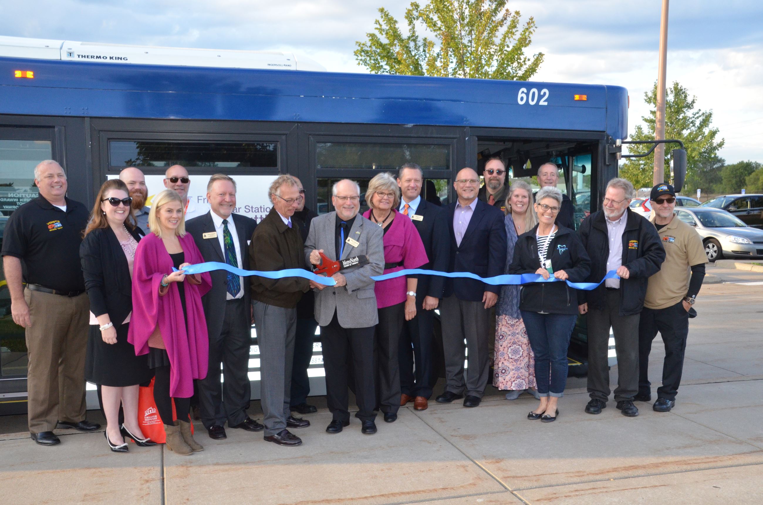 The commissioners, MetroNorth Chamber of Commerce, and Voigt management cutting the ribbon