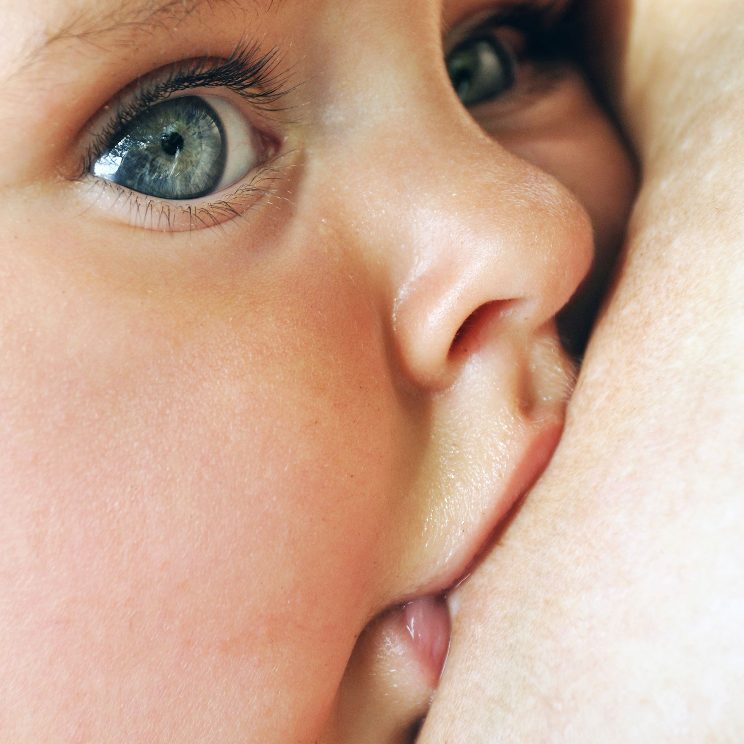 Close up view of a baby breastfeeding