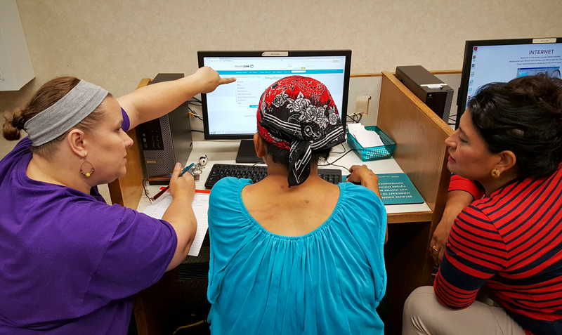 People gathered around computers