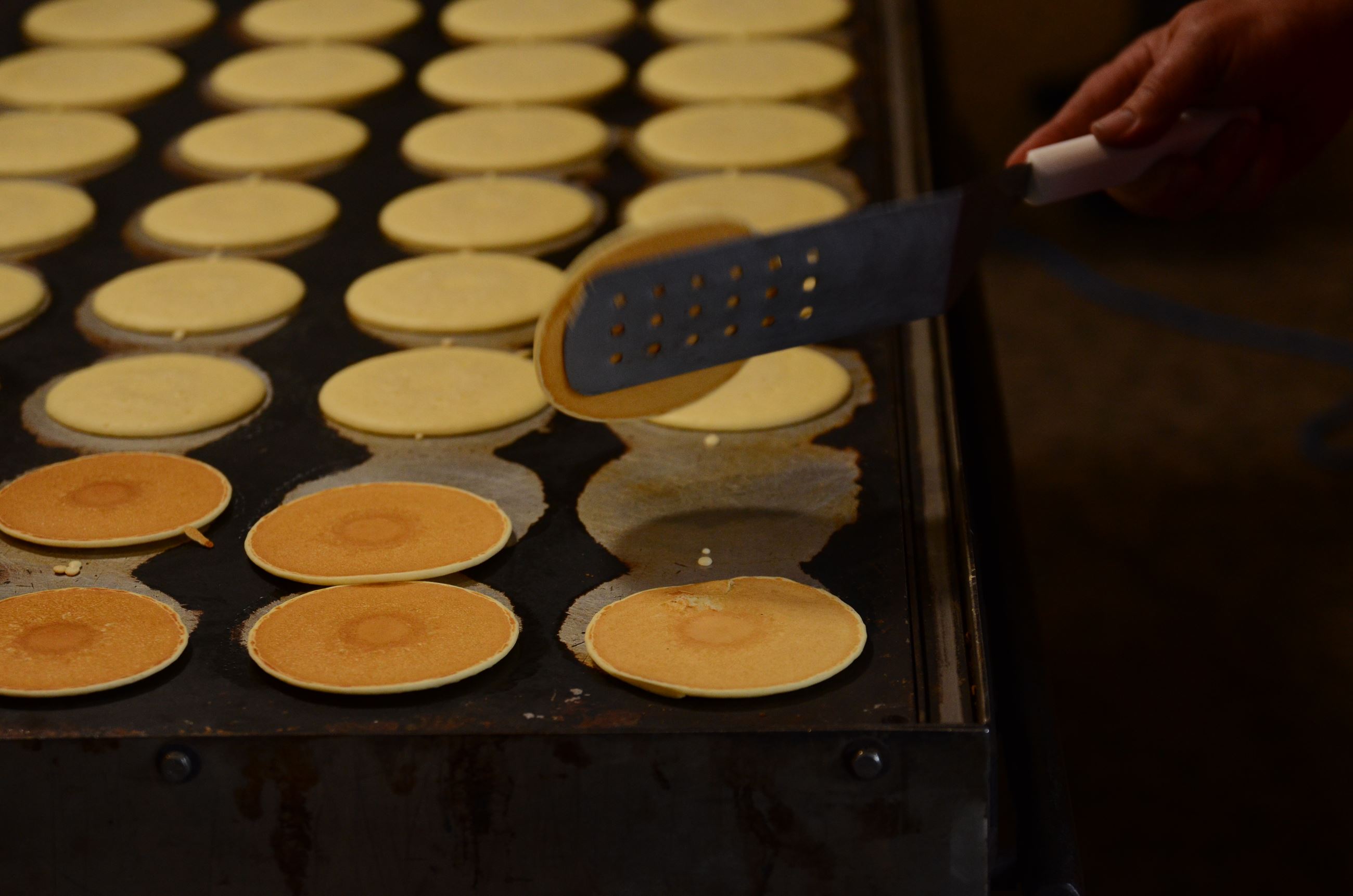 Pancakes being cooked on a griddle