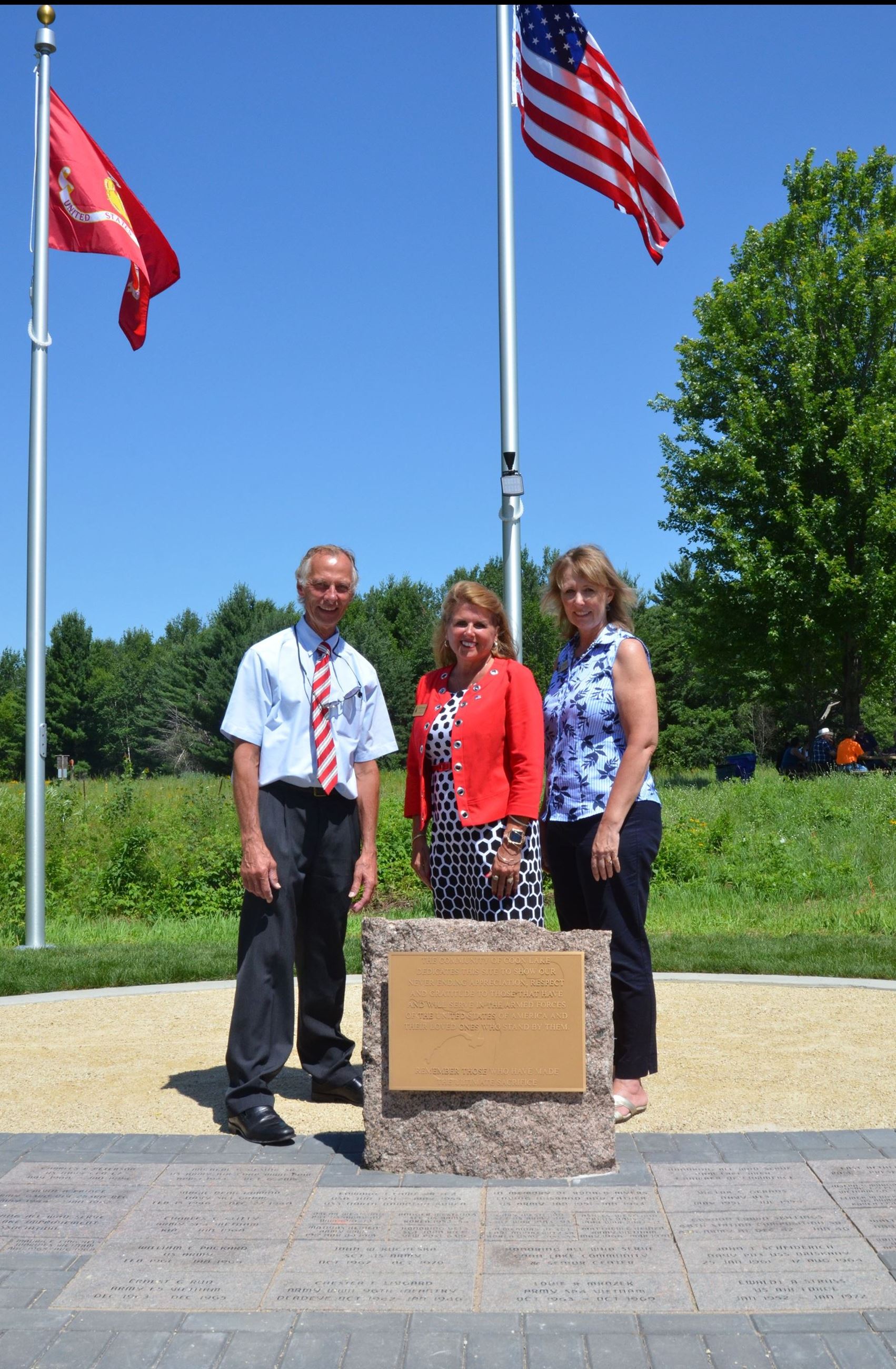 Commissioners Kordiak, Braastad, and Sivarajah with the new plaque
