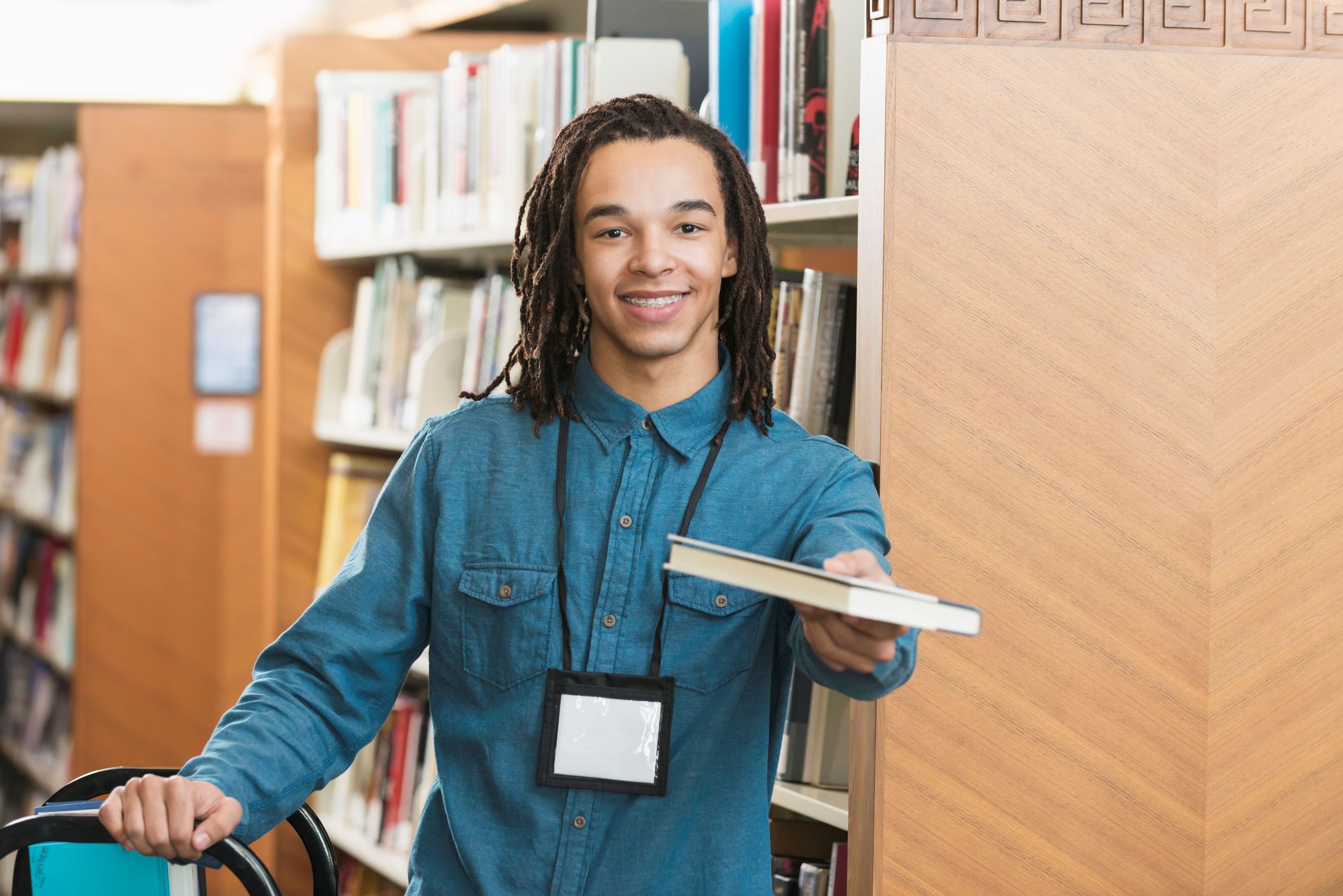 Man at library volunteering