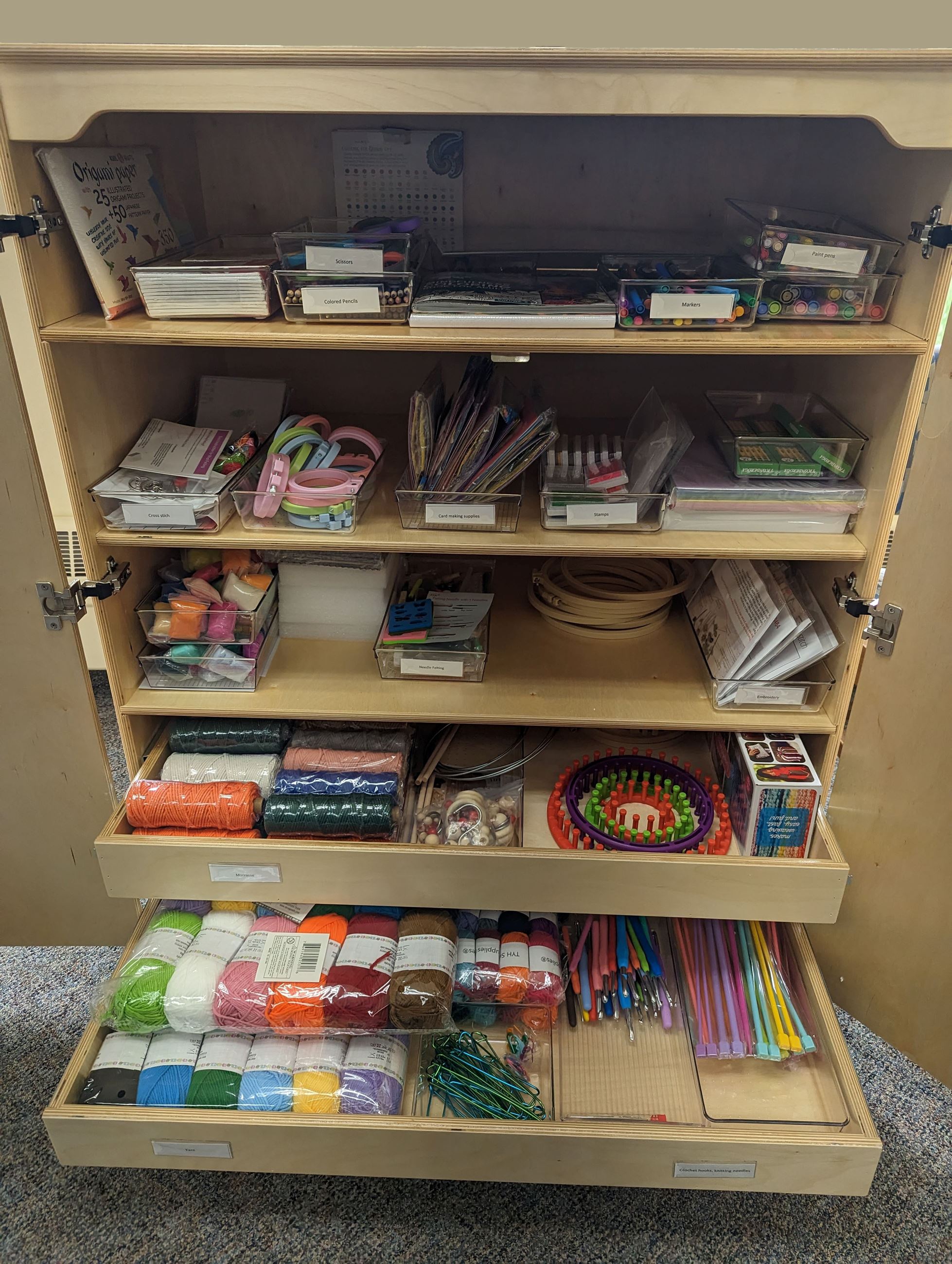 Crafters Pantry- cabinet with drawers that pull out filled with materials for craft projects